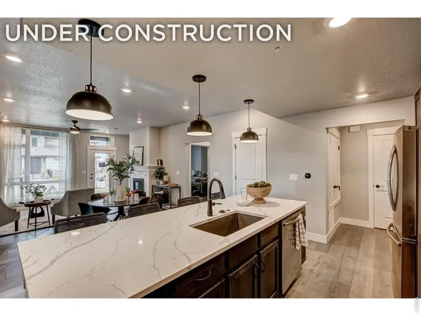 a kitchen with sink a counter and cabinets