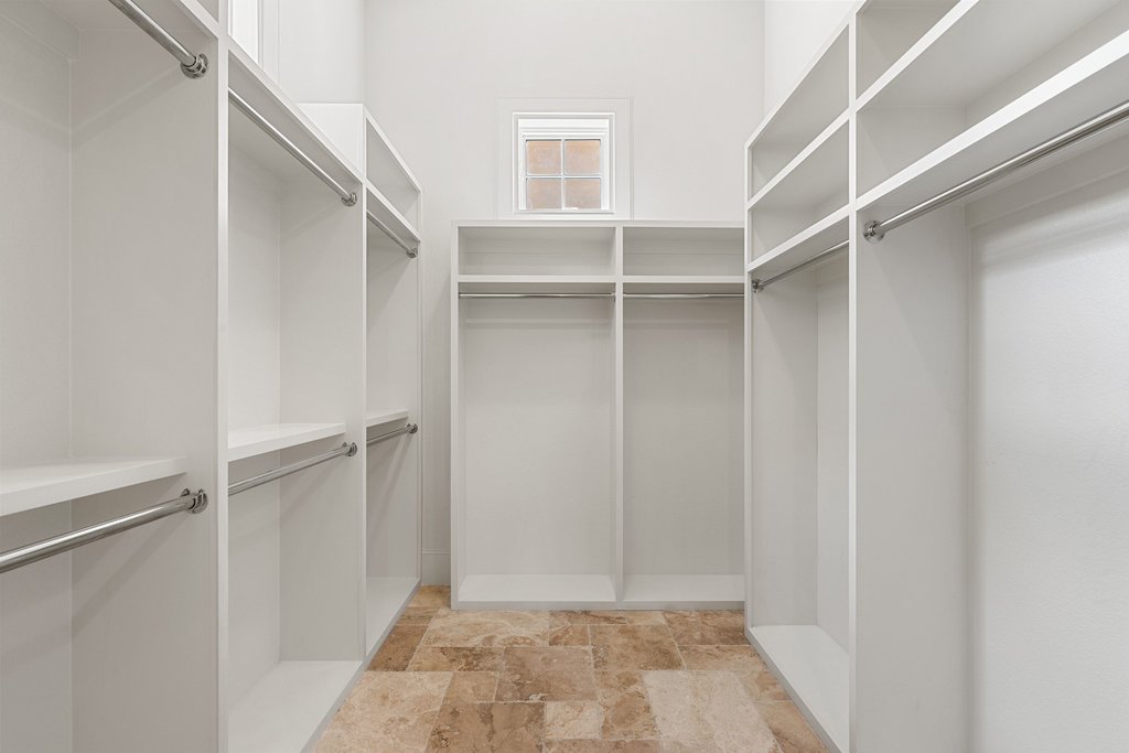102 Long Point Cove Georgetown, TX 78628 - Photo 25 of 36 a view of walk in closet with empty racks