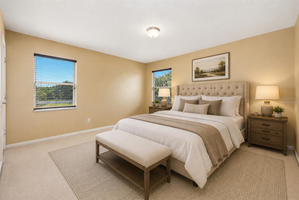 936 Kingsridge Circle Gotha, FL 34734 - Photo 16 of 50 a bedroom with a bed and a window