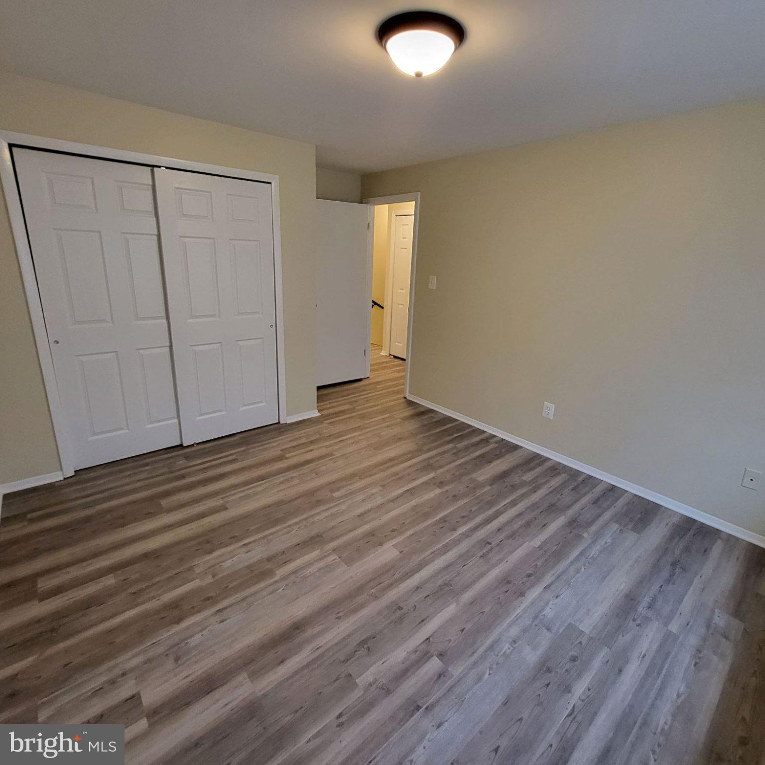 8 Perryfalls Place Nottingham, MD 21236 - Photo 14 of 23 Spacious room with modern flooring.