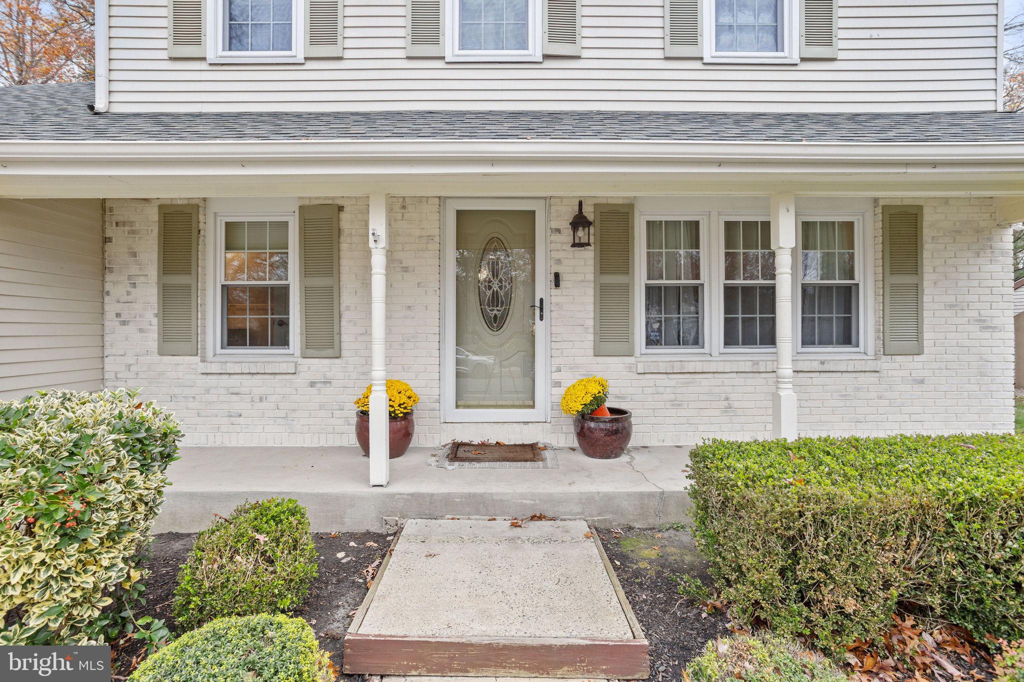 36 Whitechapel Drive Mount Laurel, NJ 08054 - Photo 5 of 36 a view of a brick house with potted plants