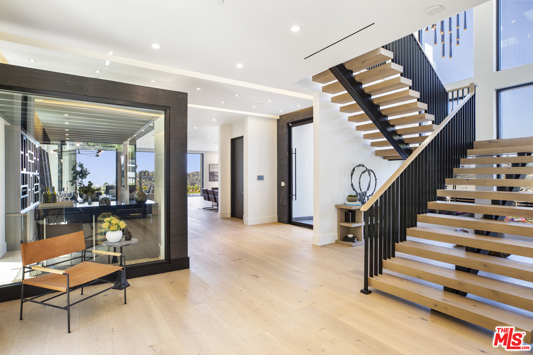 1754 Clear View Drive Beverly Hills, CA 90210 - Photo 2 of 37 a view of hall way with furniture and staircase