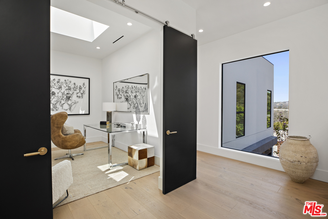 1754 Clear View Drive Beverly Hills, CA 90210 - Photo 17 of 37 a living room with furniture and a table
