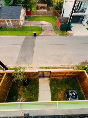 a view of swimming pool with a yard and potted plants