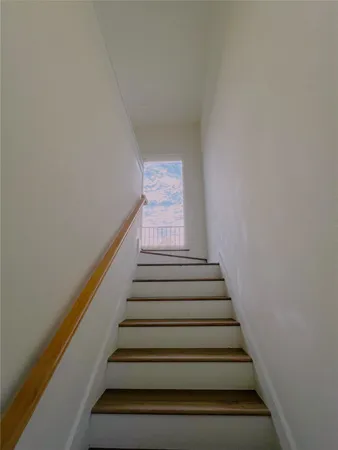 a view of a kitchen from the hallway