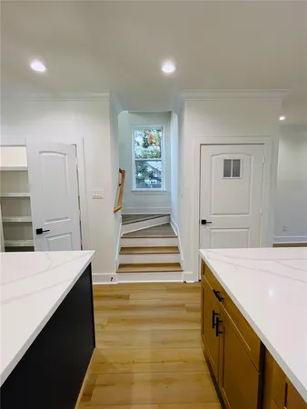 a view of gallery with wooden floor