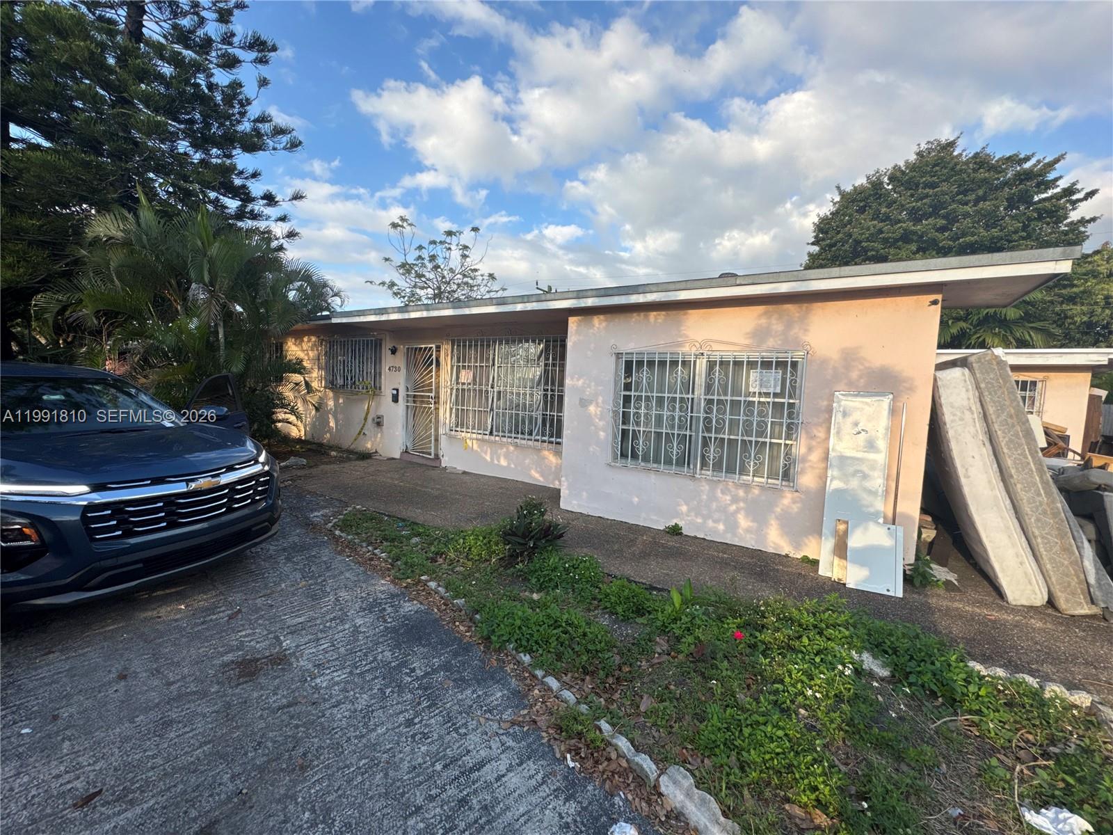 4730 West 8th Avenue Hialeah, FL 33012 - Photo 1 of 1 a view of a house with a back yard