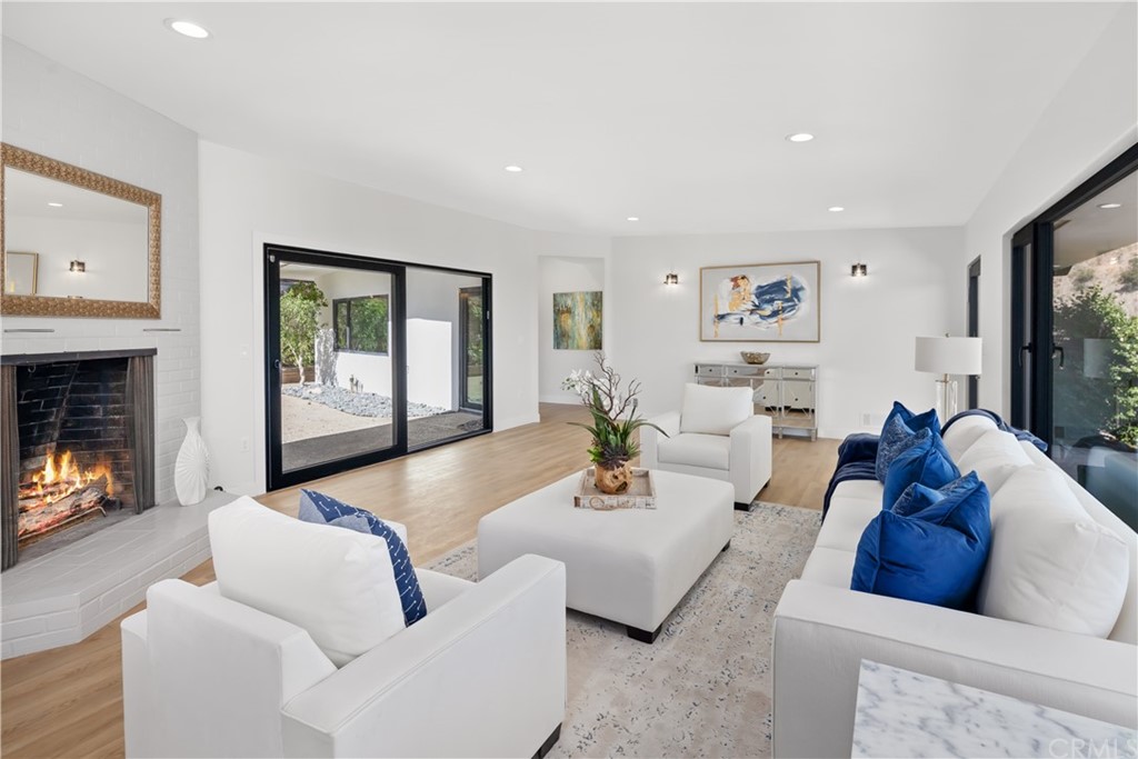 915 Ridgeside Drive Monrovia, CA 91016 - Photo 20 of 75 a living room with furniture and a fireplace