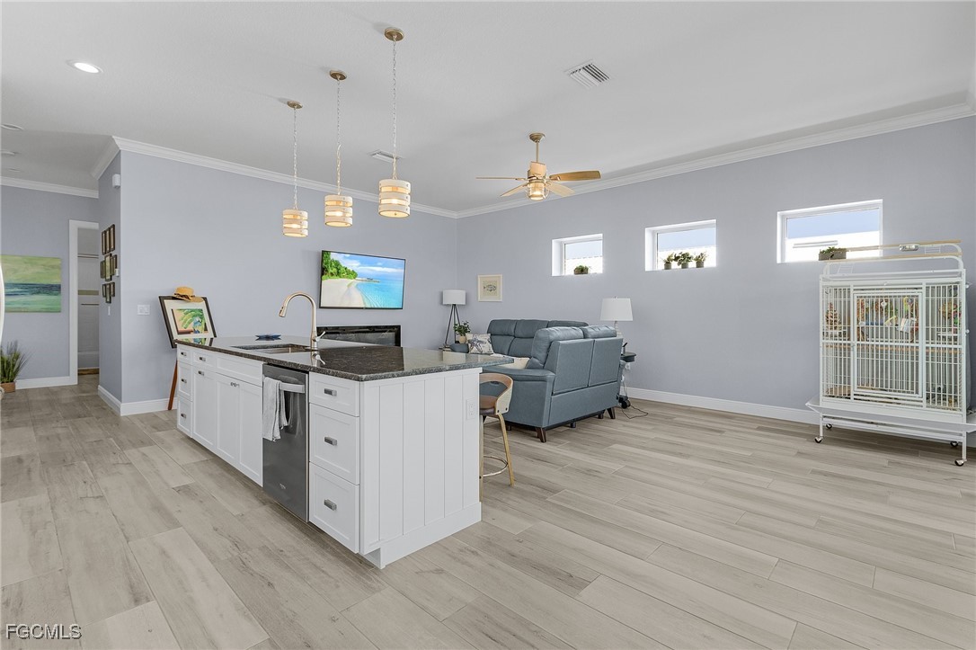 2265 York Road St. James City, FL 33956 - Photo 13 of 39 a living room with furniture and a wooden floor