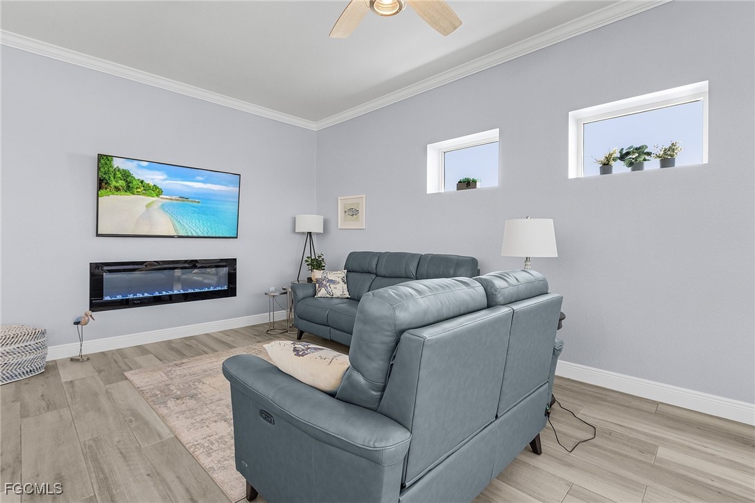 2265 York Road St. James City, FL 33956 - Photo 14 of 39 a living room with furniture and a flat screen tv