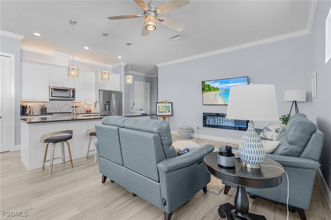 2265 York Road St. James City, FL 33956 - Photo 15 of 39 a living room with furniture and kitchen view