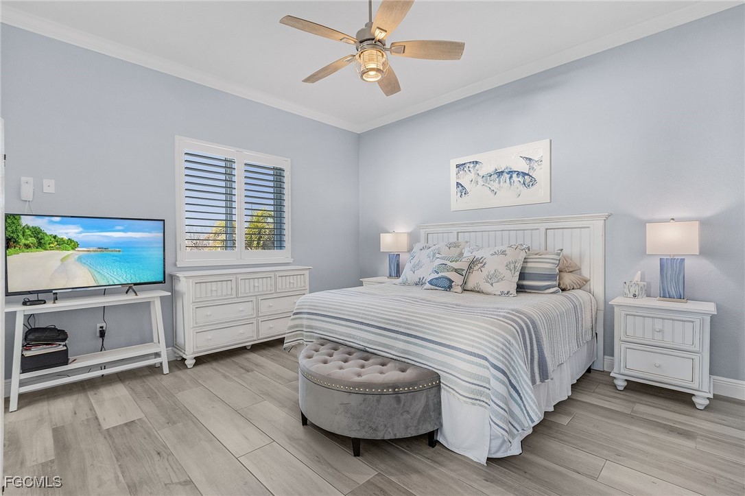 2265 York Road St. James City, FL 33956 - Photo 16 of 39 a bedroom with a bed and a flat screen tv