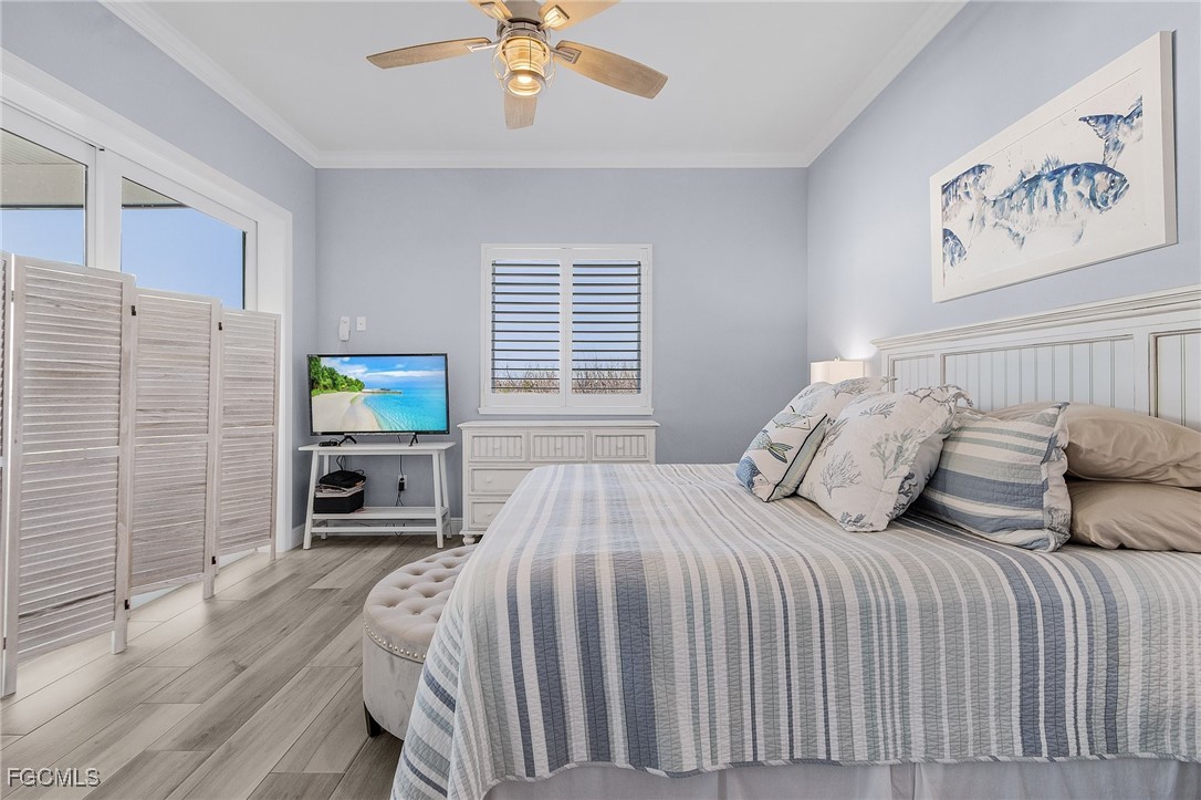 2265 York Road St. James City, FL 33956 - Photo 17 of 39 a bedroom with a bed and a television