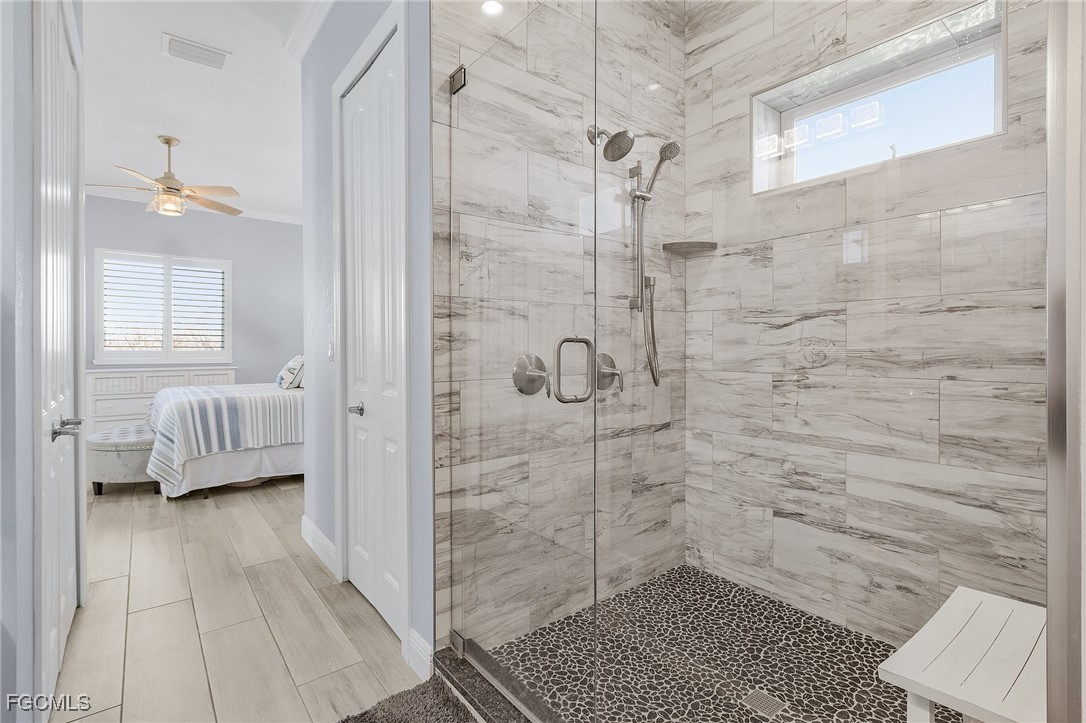 2265 York Road St. James City, FL 33956 - Photo 19 of 39 a bathroom with a shower