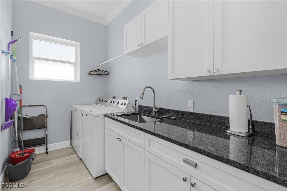 2265 York Road St. James City, FL 33956 - Photo 23 of 39 a kitchen with granite countertop white cabinets and a sink