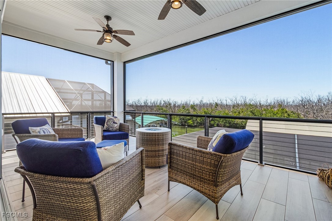 2265 York Road St. James City, FL 33956 - Photo 24 of 39 a roof deck with couches and potted plants