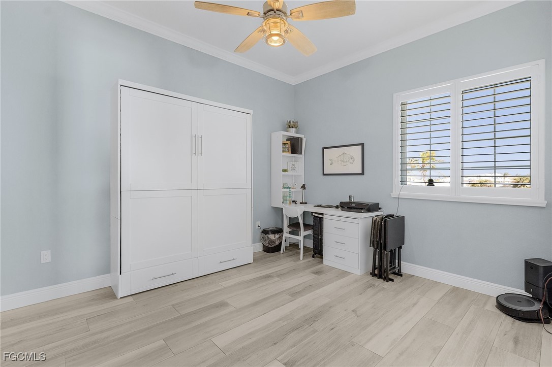 2265 York Road St. James City, FL 33956 - Photo 26 of 39 a view of a workspace with furniture and a window