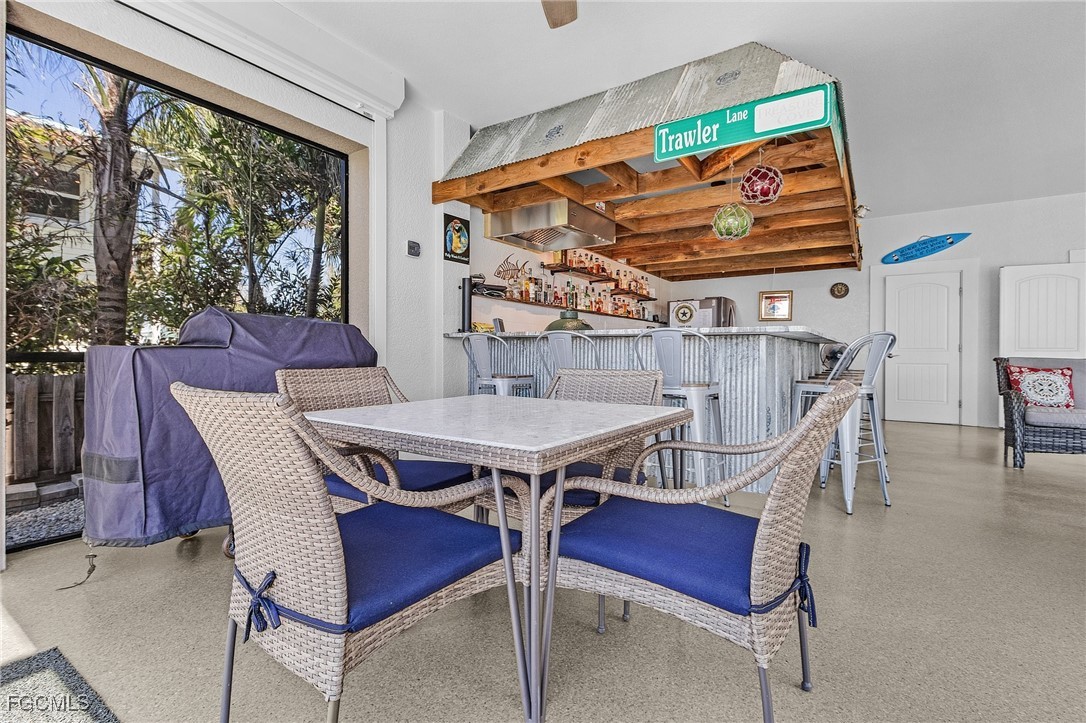 2265 York Road St. James City, FL 33956 - Photo 29 of 39 a view of a dining room with furniture window and outside view