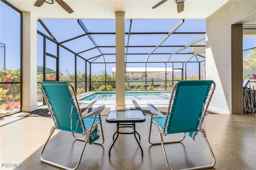 2265 York Road St. James City, FL 33956 - Photo 30 of 39 a view of a dining room with furniture window and wooden floor