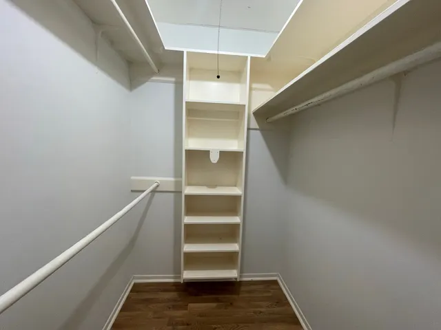 a view of an empty walk in closet