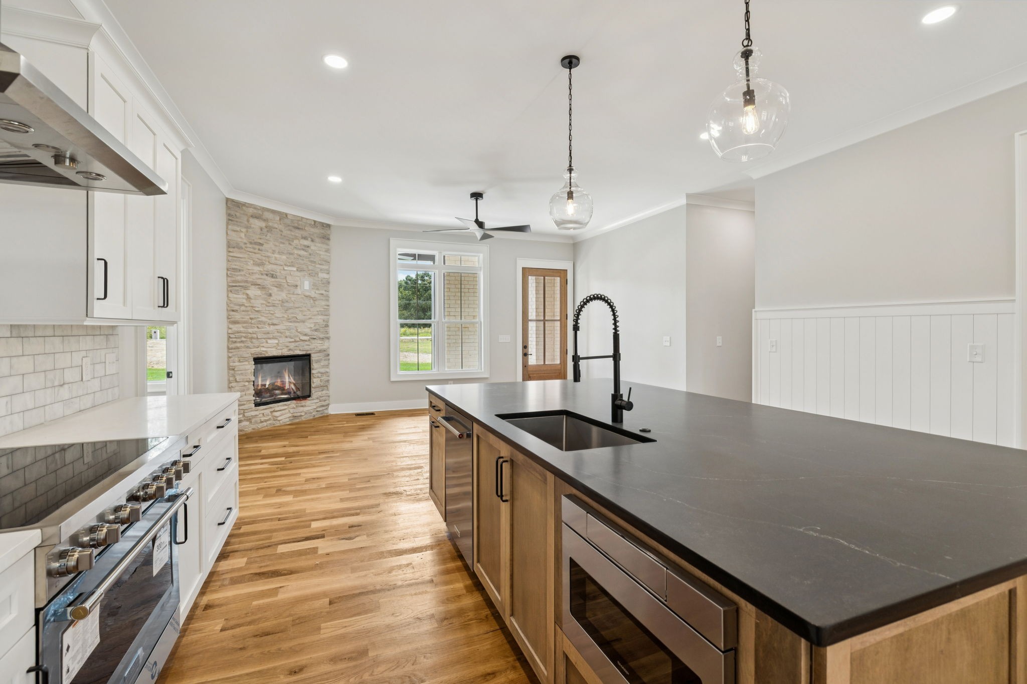 8297 12 Corners Road Lascassas, TN 37085 - Photo 16 of 63 a kitchen with stainless steel appliances a sink stove and cabinets