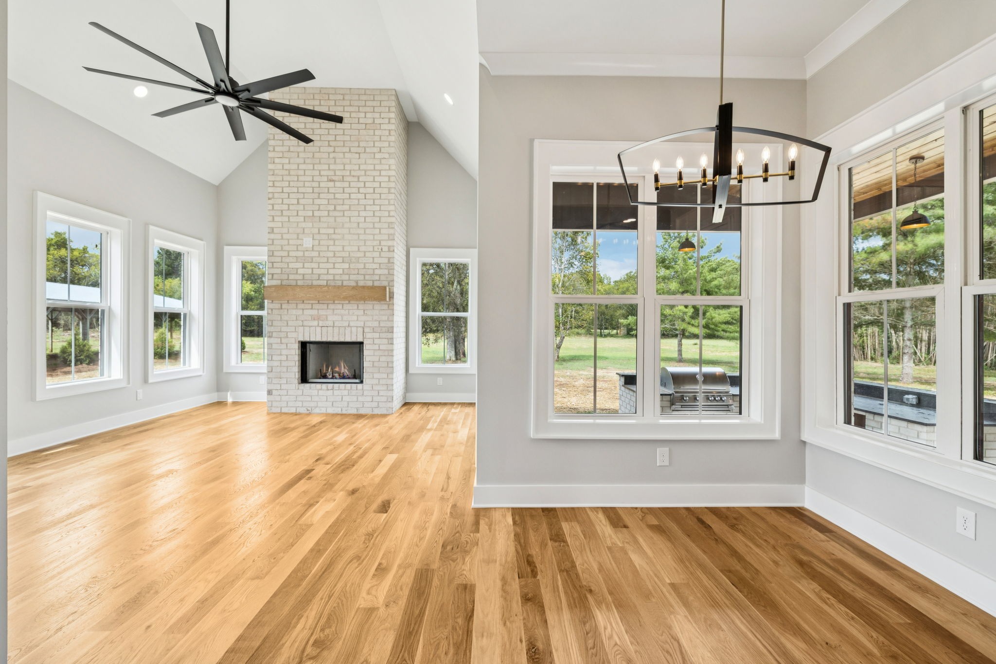 8297 12 Corners Road Lascassas, TN 37085 - Photo 20 of 63 a view of an empty room with wooden floor and a window