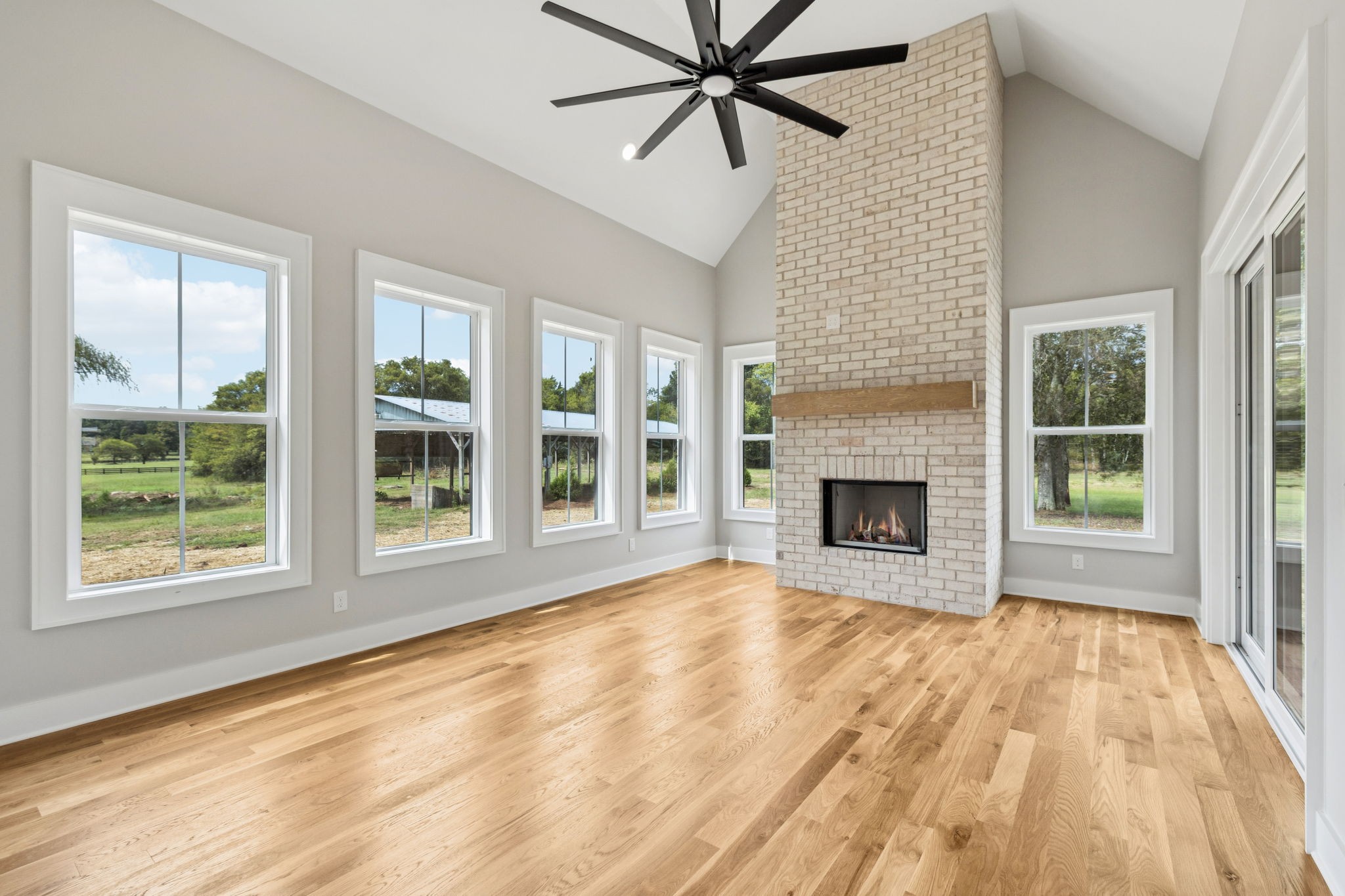 8297 12 Corners Road Lascassas, TN 37085 - Photo 21 of 63 a view of an empty room with window and fire place
