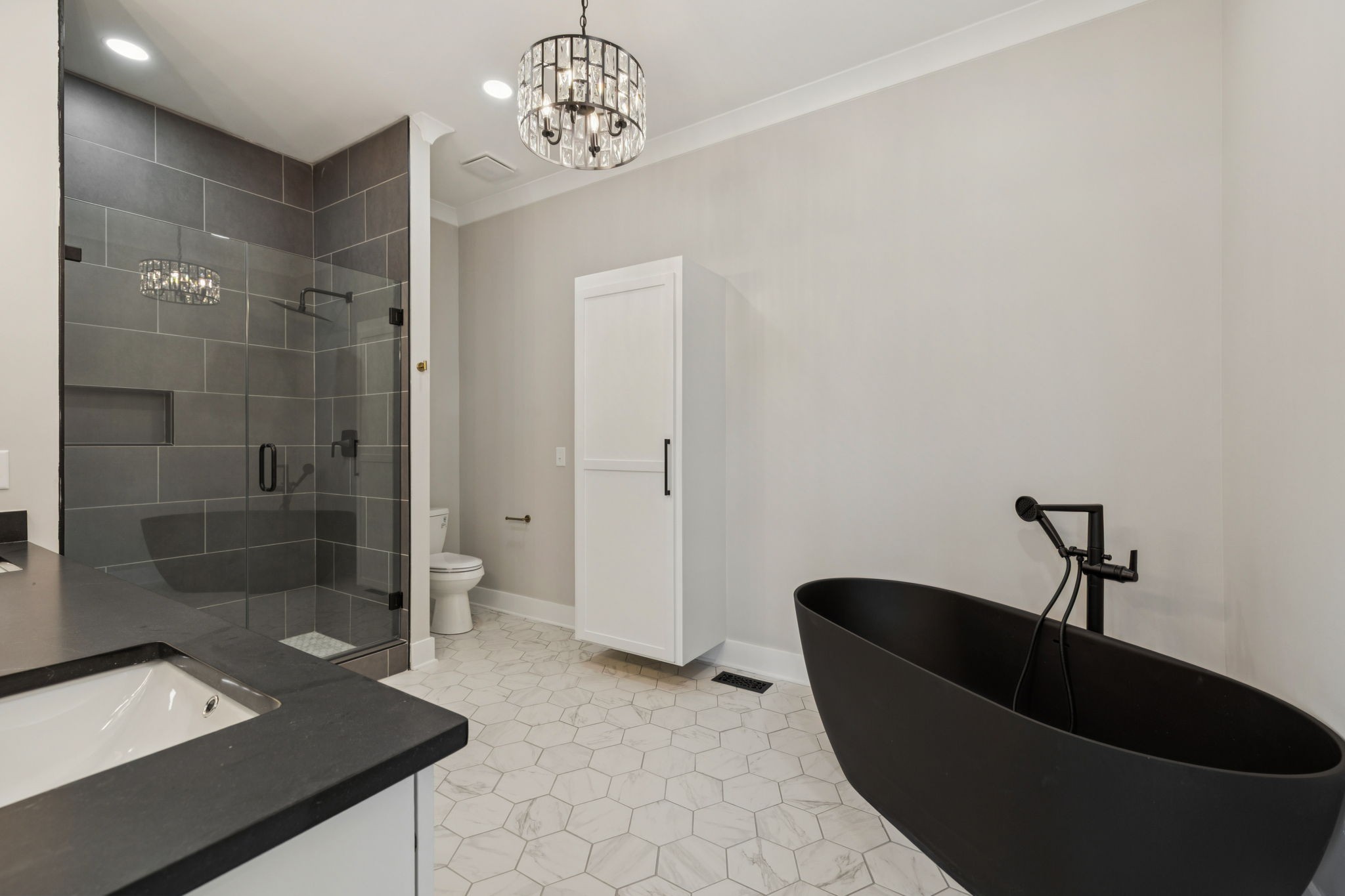 8297 12 Corners Road Lascassas, TN 37085 - Photo 29 of 63 a living room with a couch and a chandelier