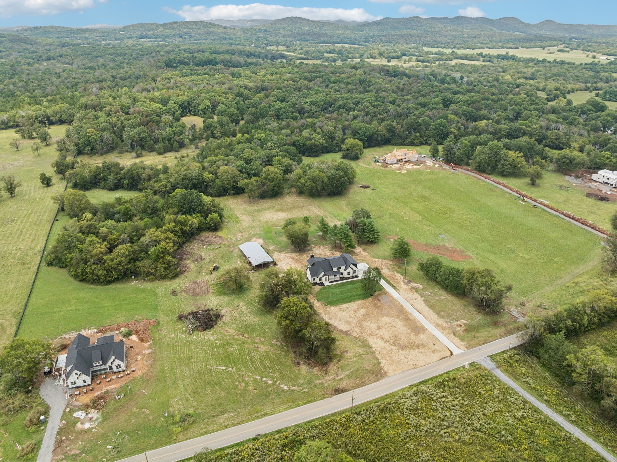 8297 12 Corners Road Lascassas, TN 37085 - Photo 62 of 63 a view of a lake with a mountain