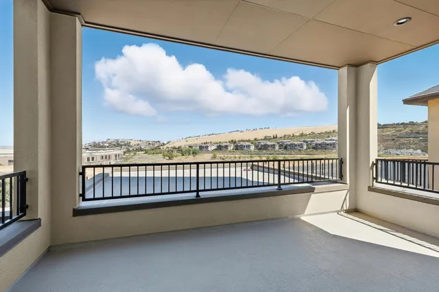 an empty room with sliding door and mountain view