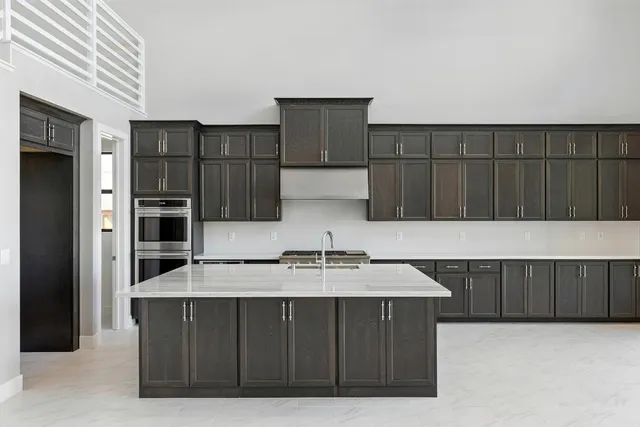 a kitchen with a sink and cabinets