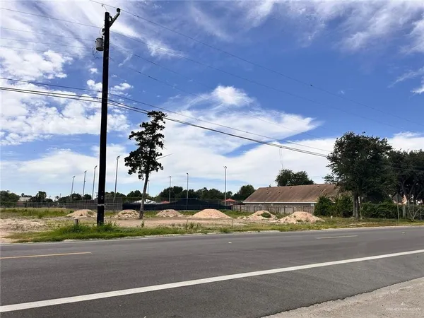 a view of a street with a building in the background