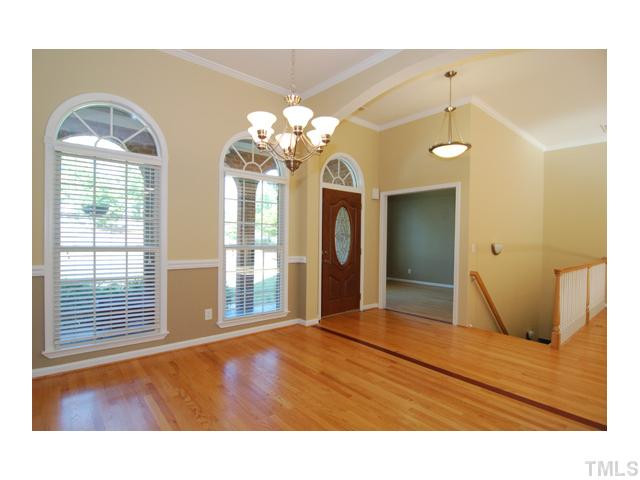 6911 Wexford Woods Trail Raleigh, NC 27613 - Photo 2 of 12 Fabulous arched entryway and view of spacious dining room. Gorgeous hardwood floors throughout most of main floor.