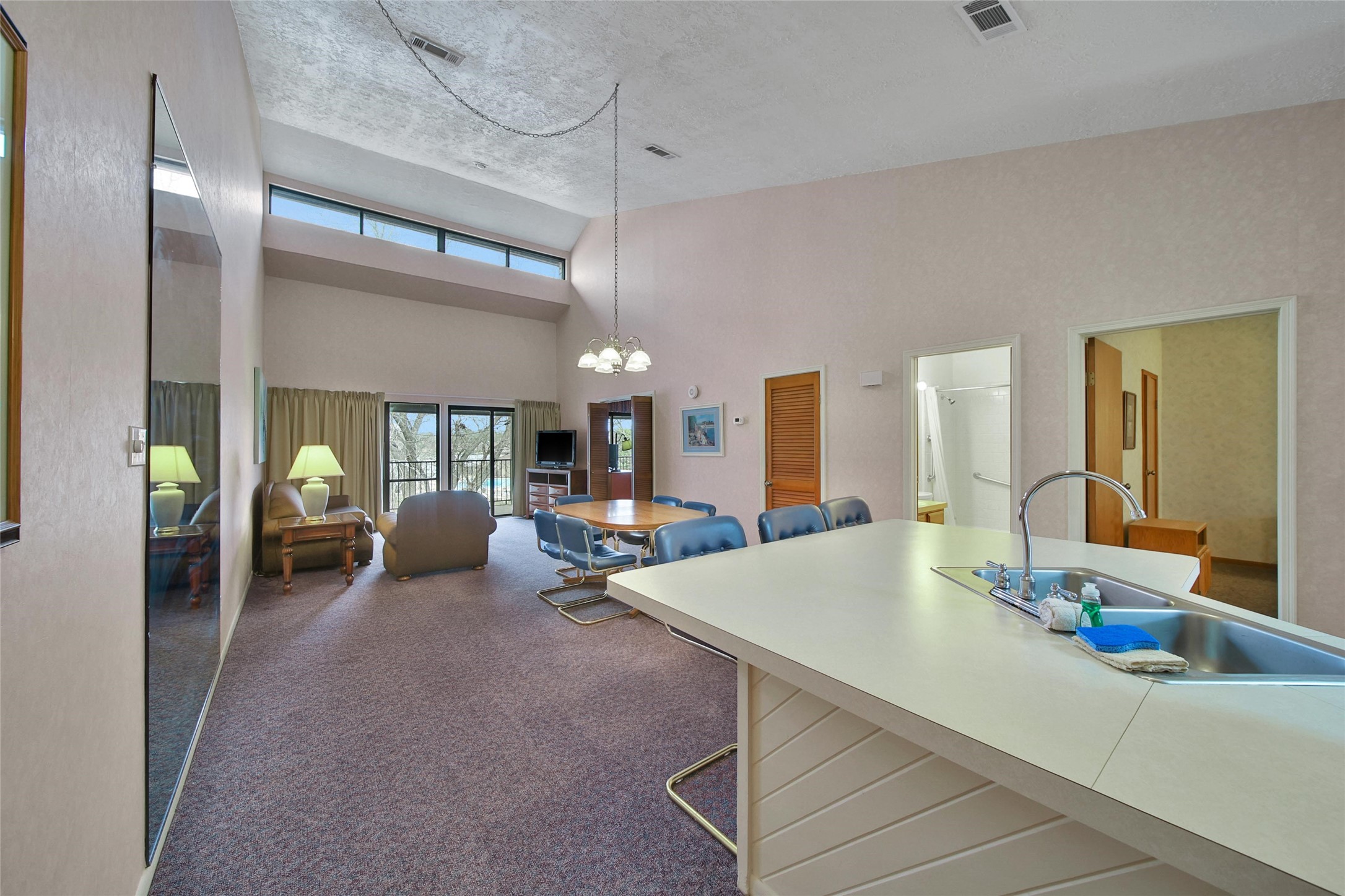 1000 April Sound Boulevard Conroe, TX 77356 - Photo 17 of 46 a living room with furniture and large windows