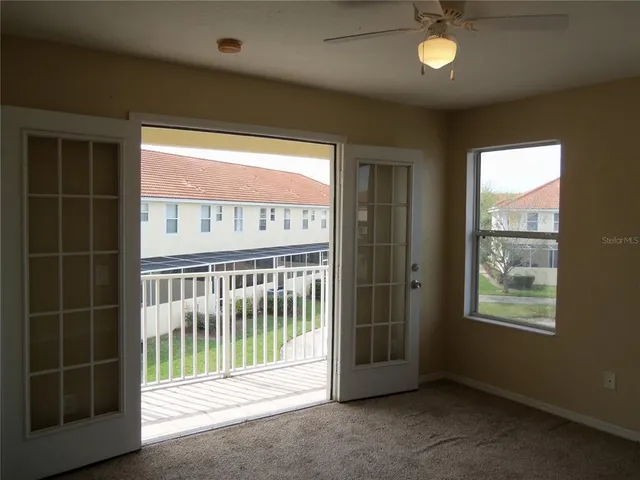a view of a living room with furniture and a window
