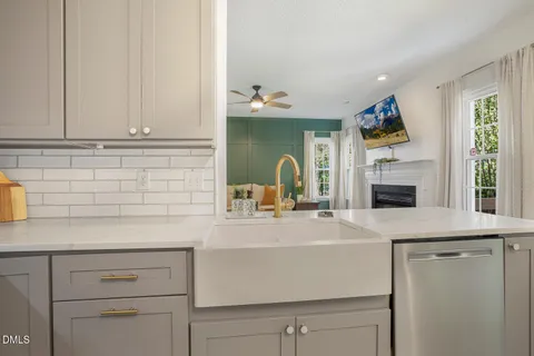 a kitchen with sink cabinets and window