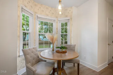 a living room with furniture ceiling fan and a rug