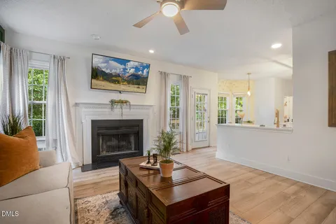 a view of front door with wooden floor and stairs
