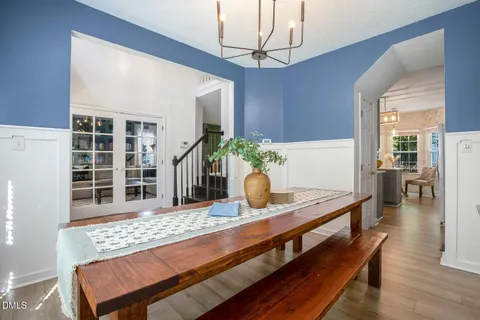 a living room with furniture and a shelf