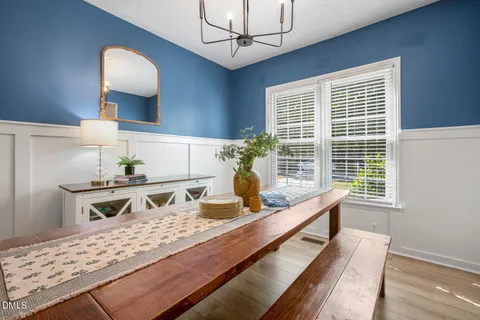 a living room with fireplace furniture and a book shelf