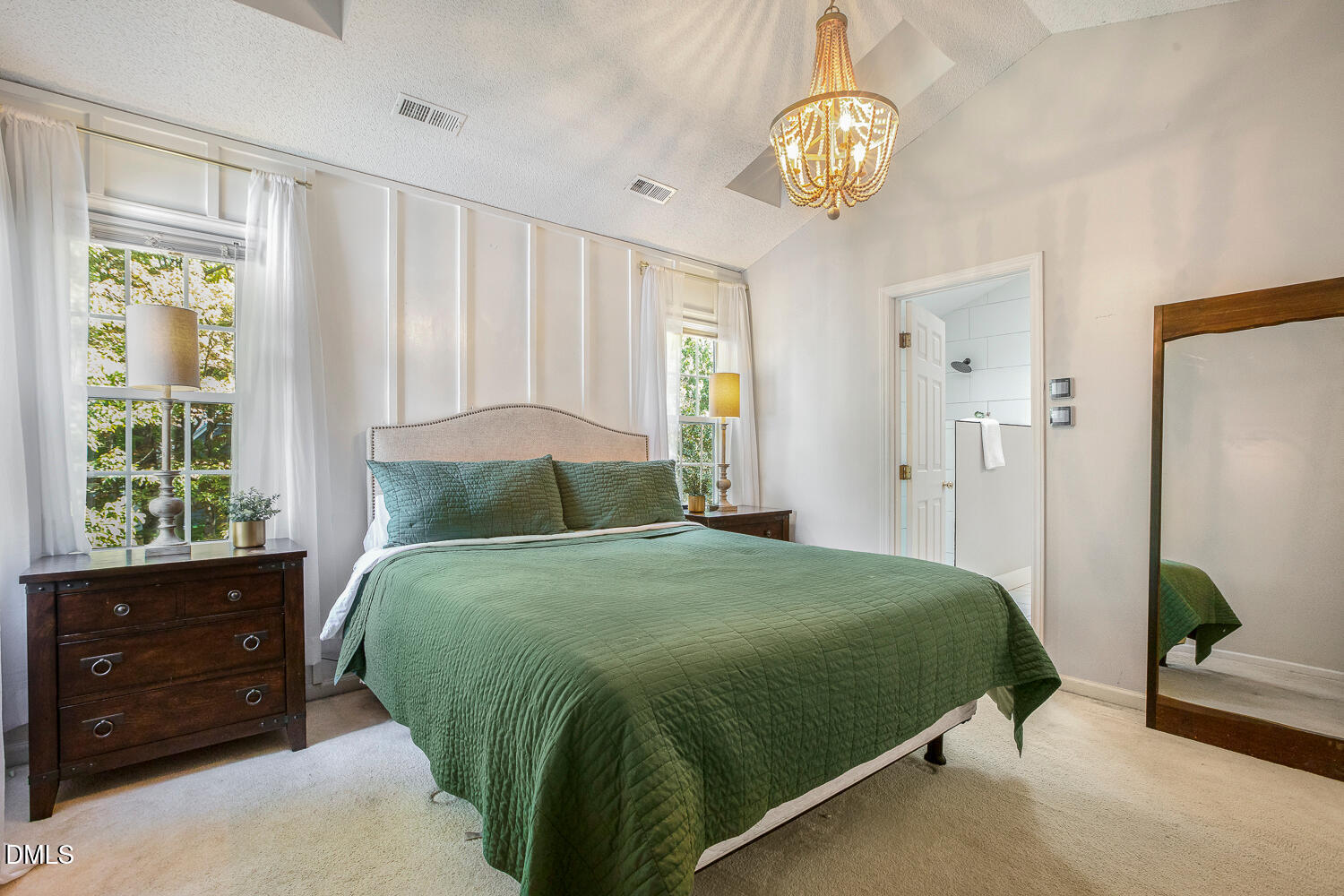 5233 Fairmead Circle Raleigh, NC 27613 - Photo 38 of 68 a bedroom with a bed and a chandelier