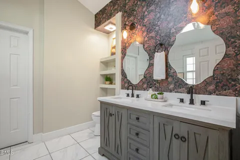 a view of a bathroom from a hallway