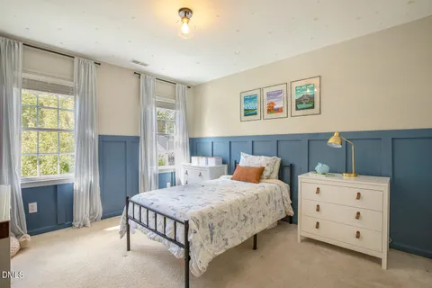 a view of a deck with a chair and table and wooden floor