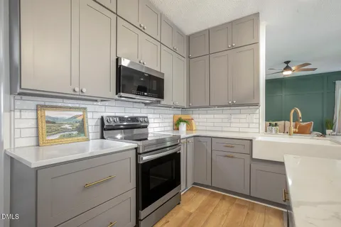 a white refrigerator freezer sitting in a kitchen
