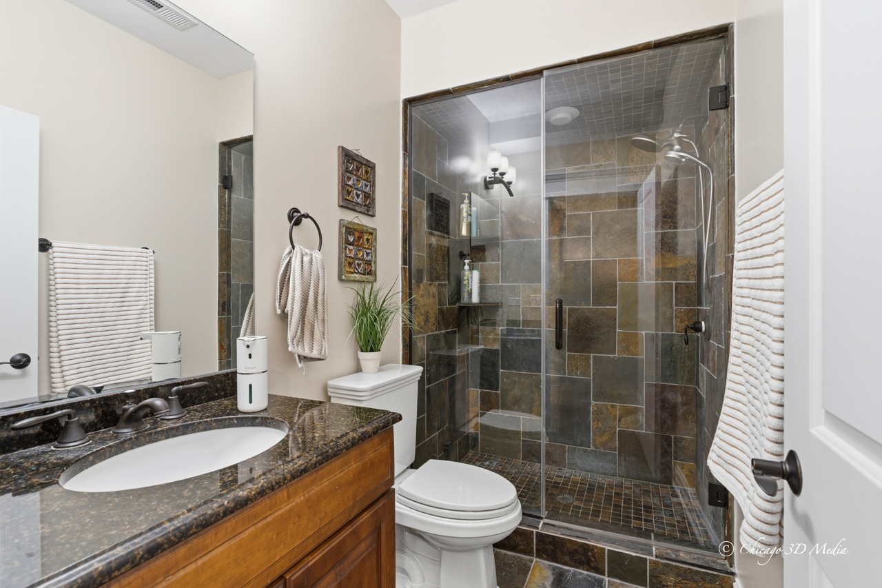 306 17th Street Wilmette, IL 60091 - Photo 37 of 48 a bathroom with a granite countertop sink toilet and shower