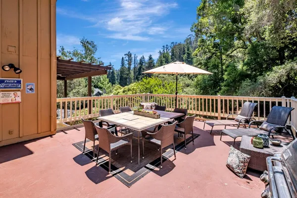 a view of backyard with hardwood floor and outdoor seating