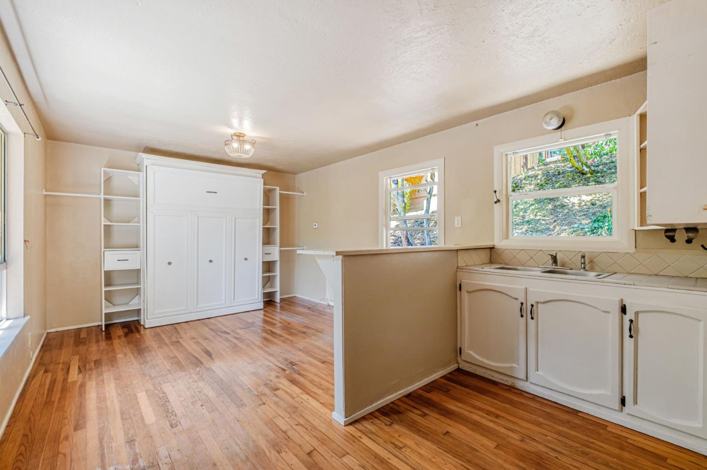 4858 Freedom Boulevard Aptos, CA 95003 - Photo 61 of 65 a view of a kitchen with wooden floor and a window