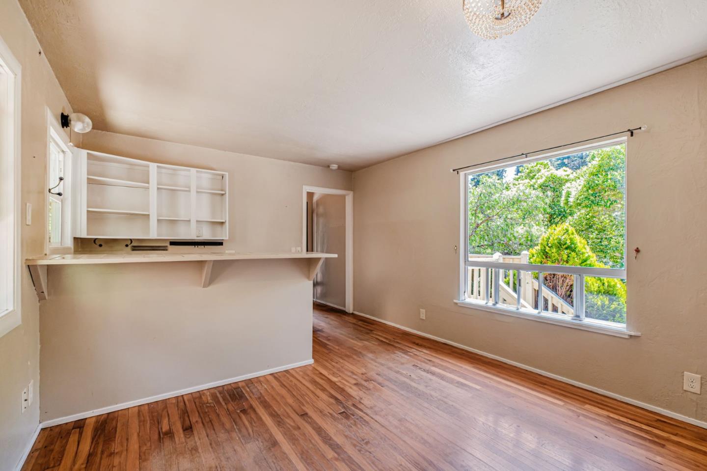 4858 Freedom Boulevard Aptos, CA 95003 - Photo 63 of 65 an empty room with wooden floor and windows