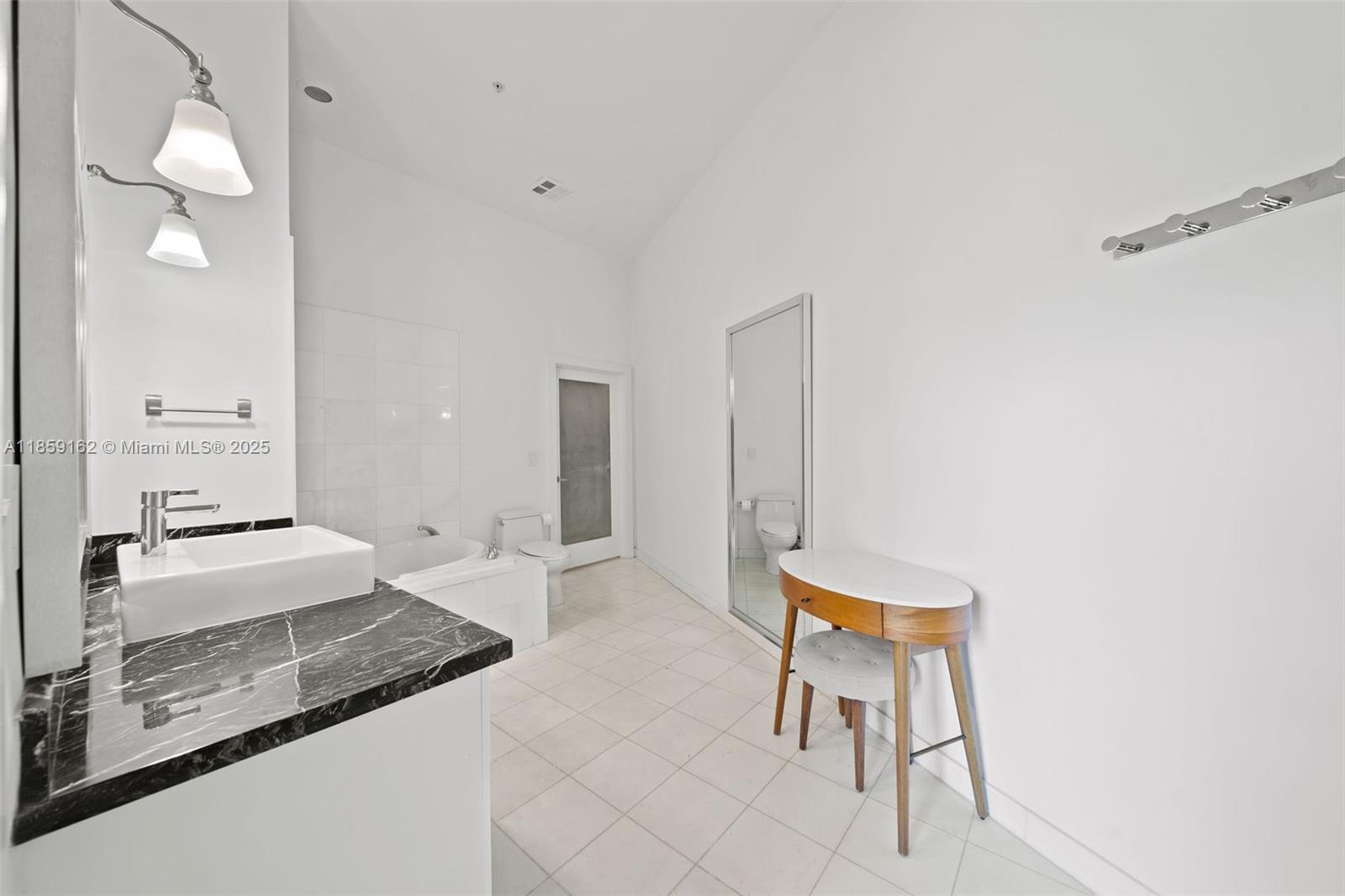 2001 Meridian Avenue, Unit 103 Miami Beach, FL 33139 - Photo 15 of 49 a living room with furniture