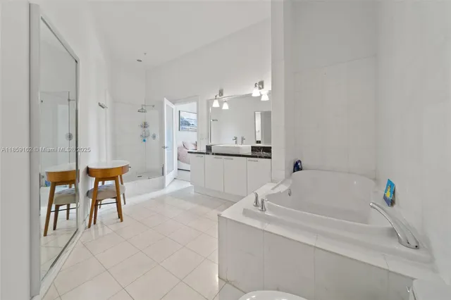 a bathroom with a bathtub and a sink